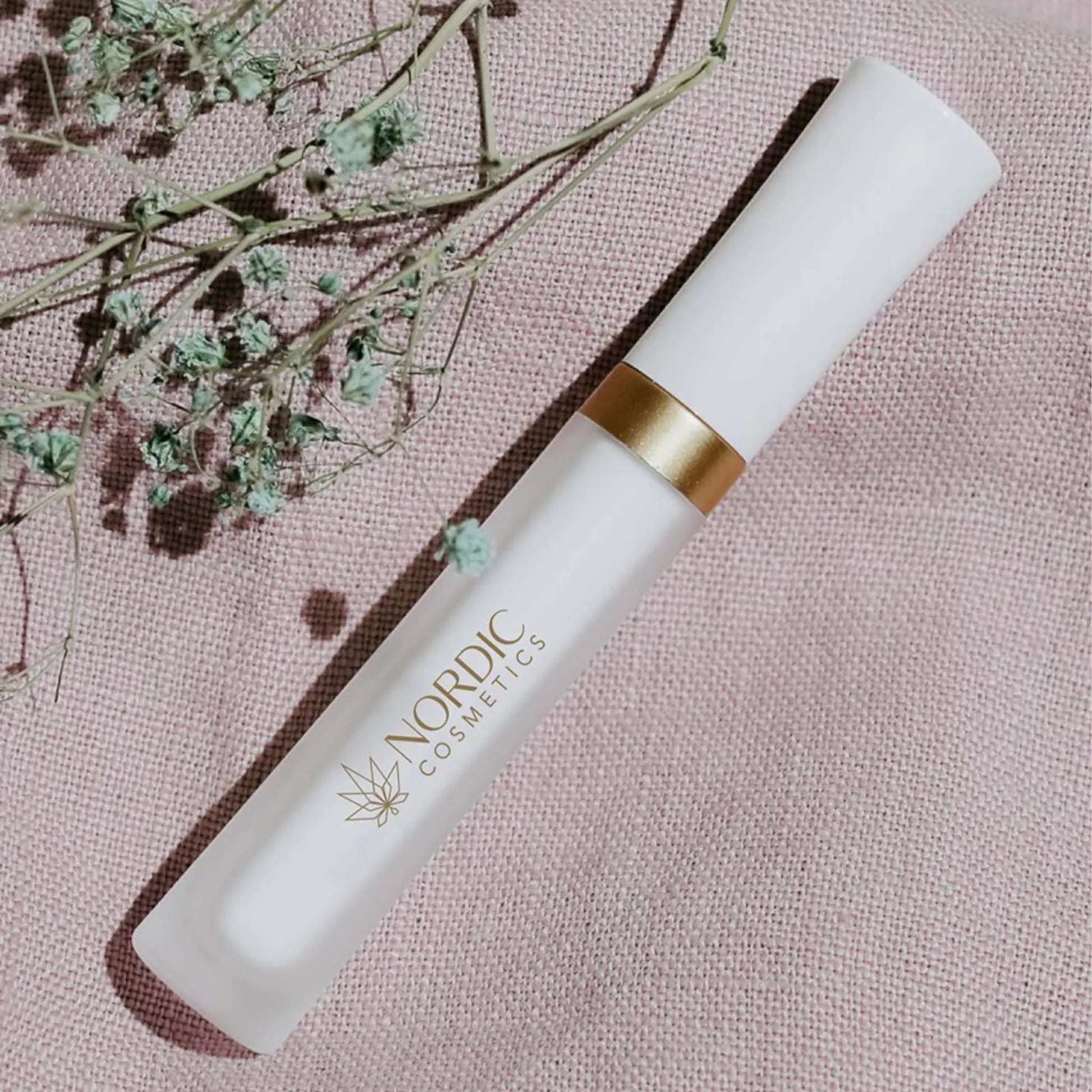 the product lays on a pink background