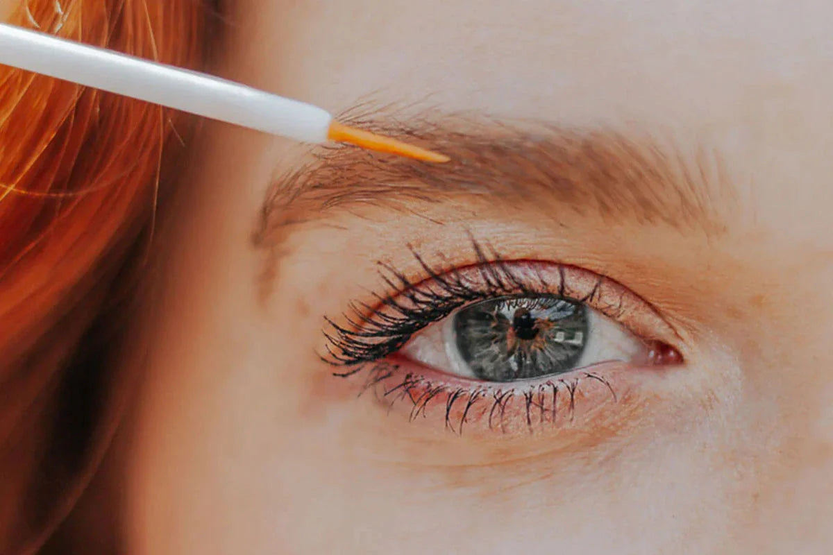 woman using lash booster