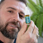 a man holds the CBD oil 