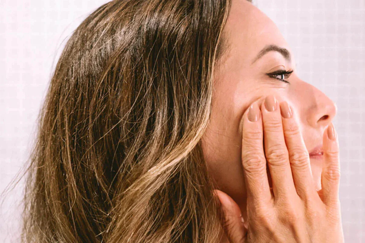 woman using anti aging cream