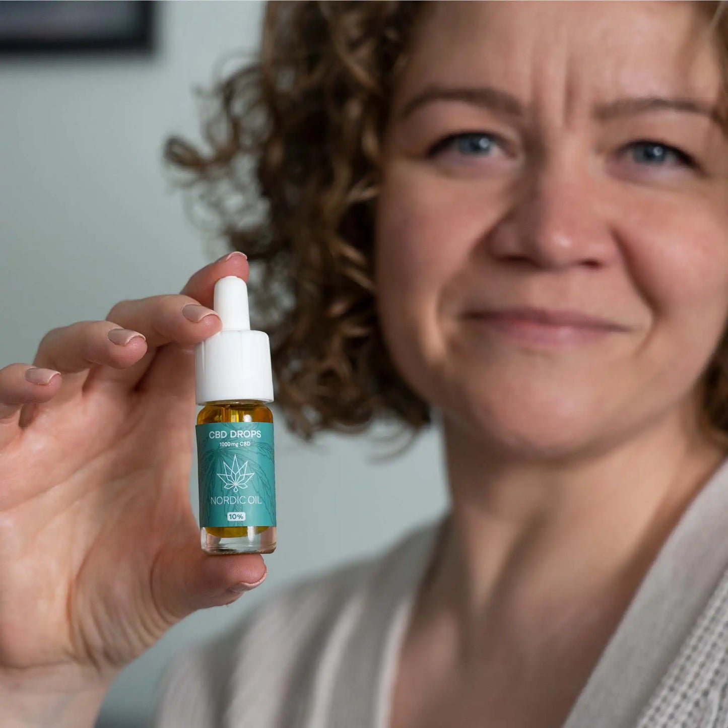 a woman holds the product in her hand